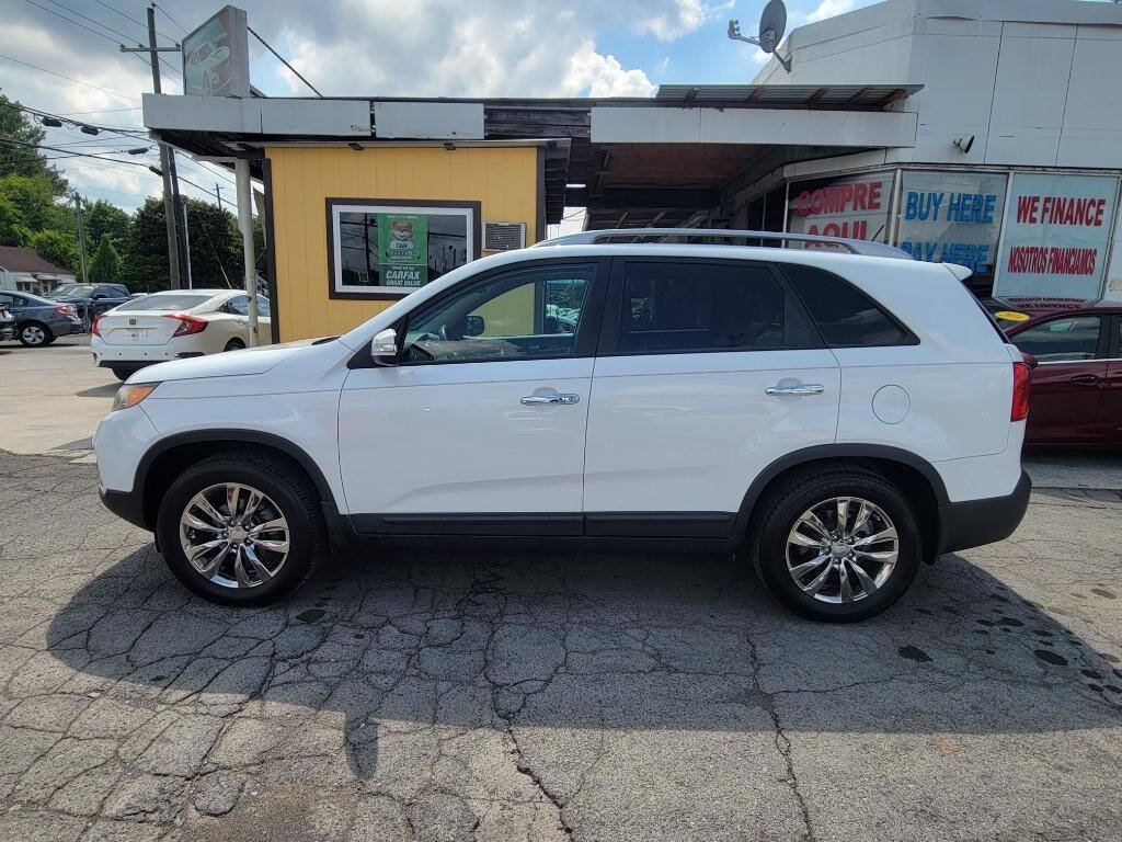 2011 Kia Sorento for sale at DAGO'S AUTO SALES LLC in Dalton, GA