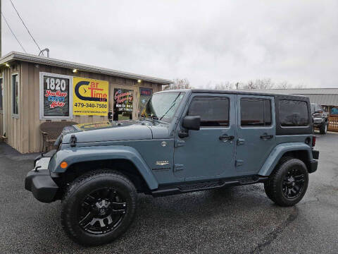 2014 Jeep Wrangler Unlimited for sale at CarTime in Rogers AR