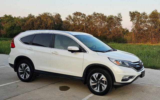 2015 Honda CR-V for sale at CAR MARKET AUTO GROUP in Sugar Land, TX