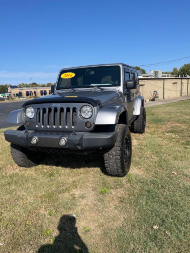 2014 Jeep Wrangler Unlimited for sale at Dixon Auto Sales in Pea Ridge, AR