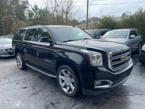 2015 GMC Yukon XL for sale at Magic Motors Inc. in Snellville GA