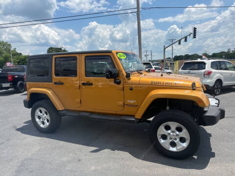 2014 Jeep Wrangler Unlimited for sale at CarTime in Rogers AR