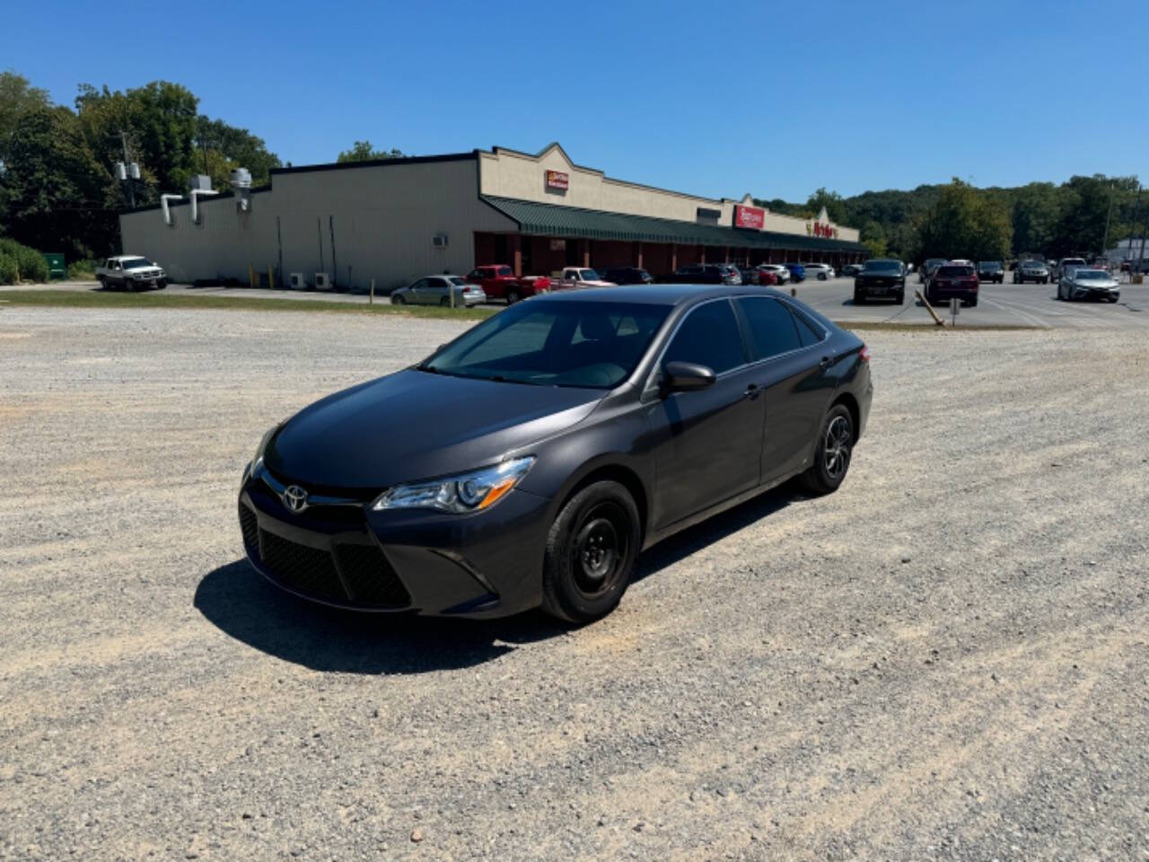 2016 Toyota Camry for sale at Guadalupe Auto Sales, LLC. in Jemison, AL