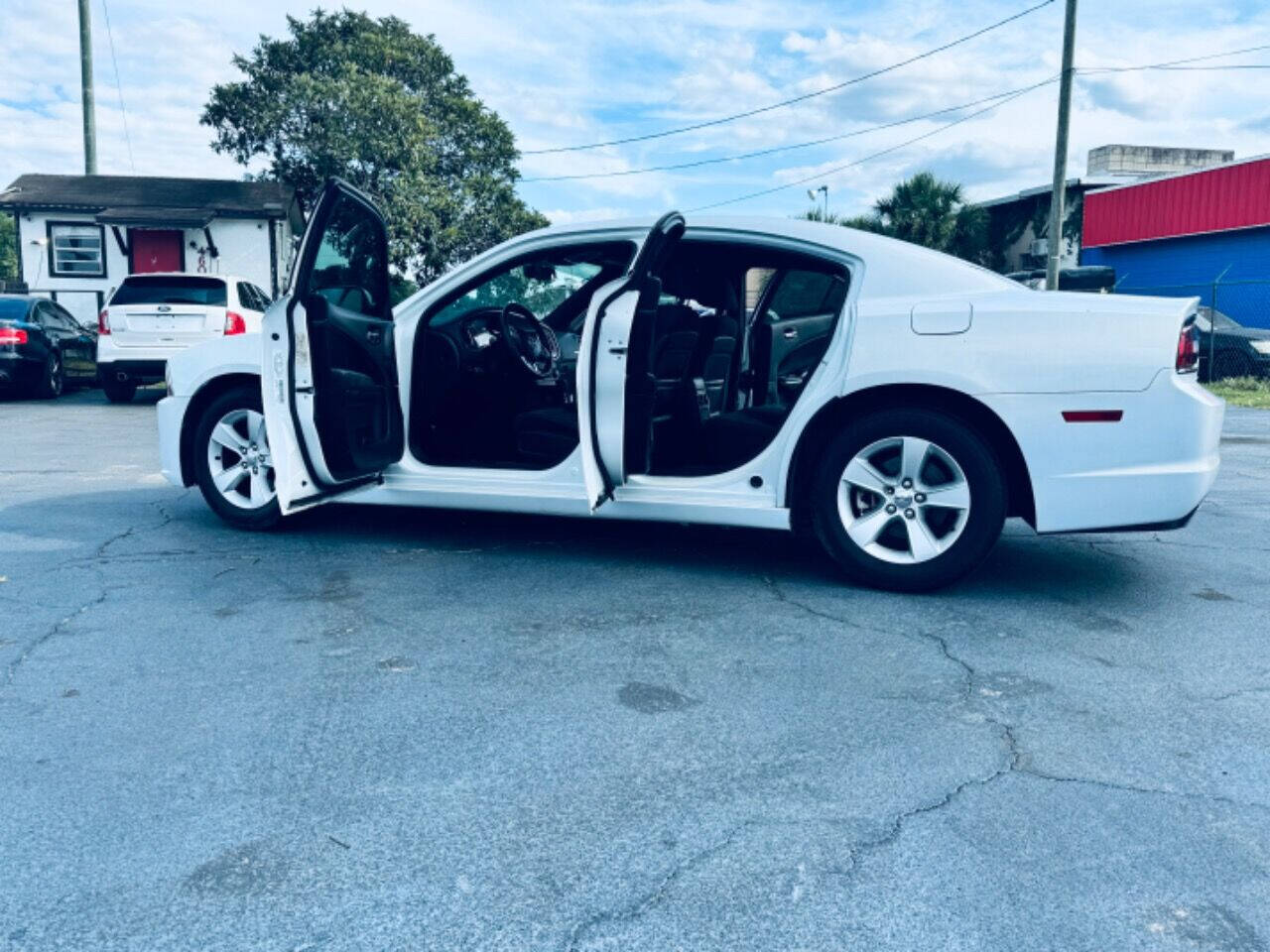 2014 Dodge Charger for sale at NOVA AUTO SALES in Orlando, FL