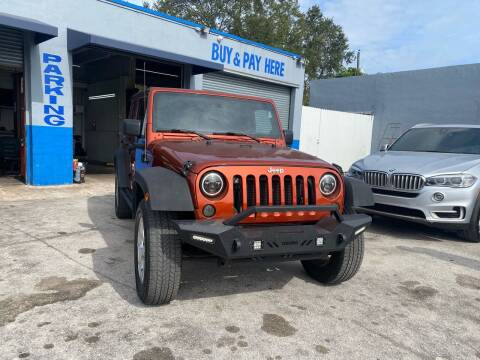 2014 Jeep Wrangler Unlimited for sale at America Auto Wholesale Inc in Miami FL