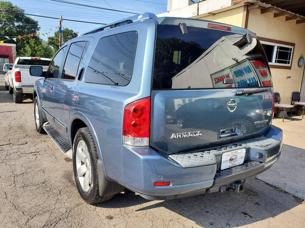 2010 Nissan Armada for sale at DAGO'S AUTO SALES LLC in Dalton, GA