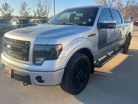 2013 Ford F-150 for sale at Azteca Auto Sales LLC in Des Moines IA