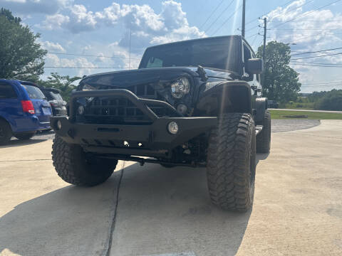 2016 Jeep Wrangler Unlimited for sale at A&C Auto Sales in Moody AL