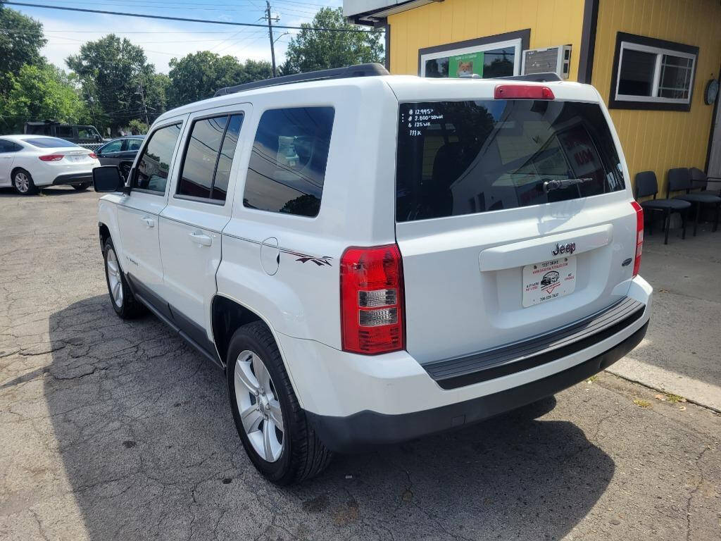 2014 Jeep Patriot for sale at DAGO'S AUTO SALES LLC in Dalton, GA