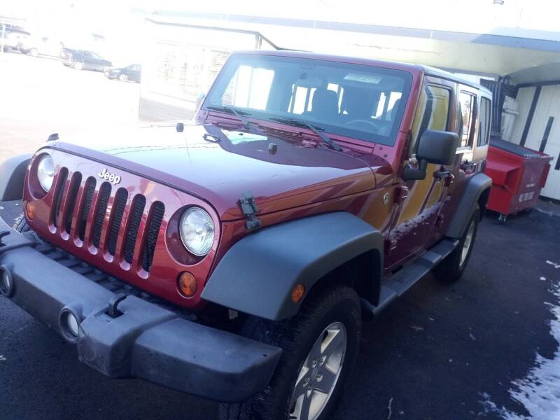 2012 Jeep Wrangler Unlimited for sale at MIRACLE AUTO SALES in Cranston RI