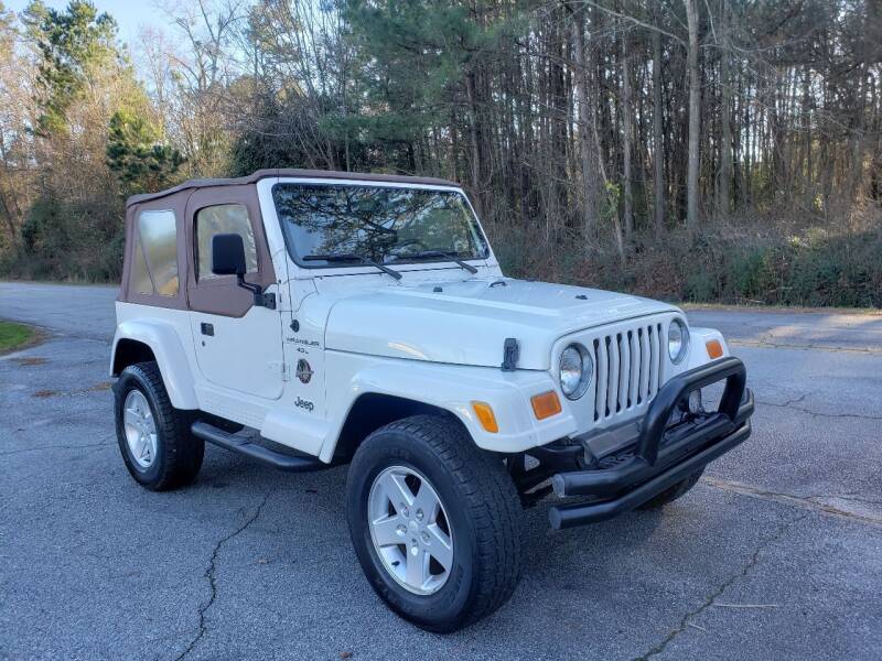 2000 Jeep Wrangler for sale at GEORGIA AUTO DEALER LLC in Buford GA