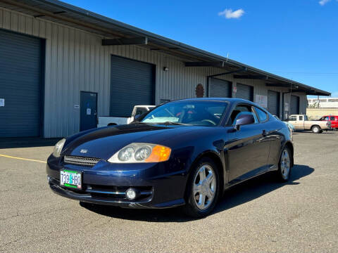 2004 Hyundai Tiburon for sale at DASH AUTO SALES LLC in Salem OR