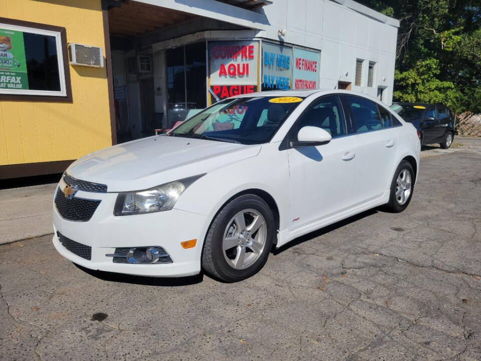 2013 Chevrolet Cruze for sale at DAGO'S AUTO SALES LLC in Dalton, GA