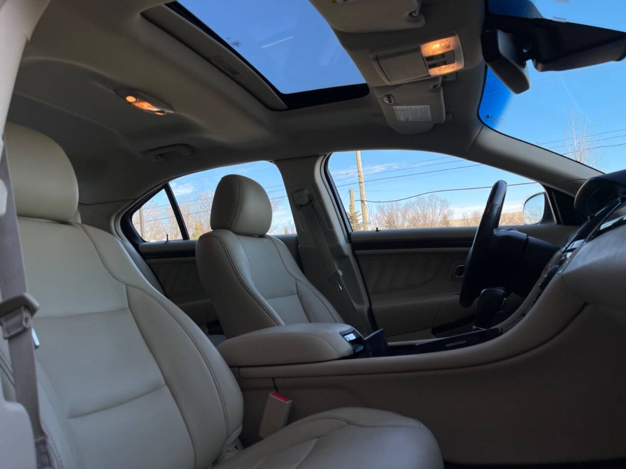 2014 Ford Taurus for sale at Phoenix Motor Co in Romulus, MI