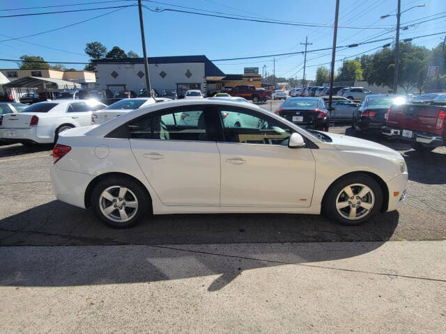 2013 Chevrolet Cruze for sale at DAGO'S AUTO SALES LLC in Dalton, GA