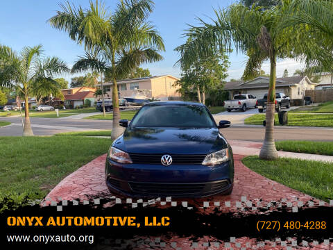 2011 Volkswagen Jetta for sale at ONYX AUTOMOTIVE, LLC in Largo FL