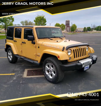 2014 Jeep Wrangler Unlimited for sale at JERRY GRADL MOTORS INC in North Tonawanda NY