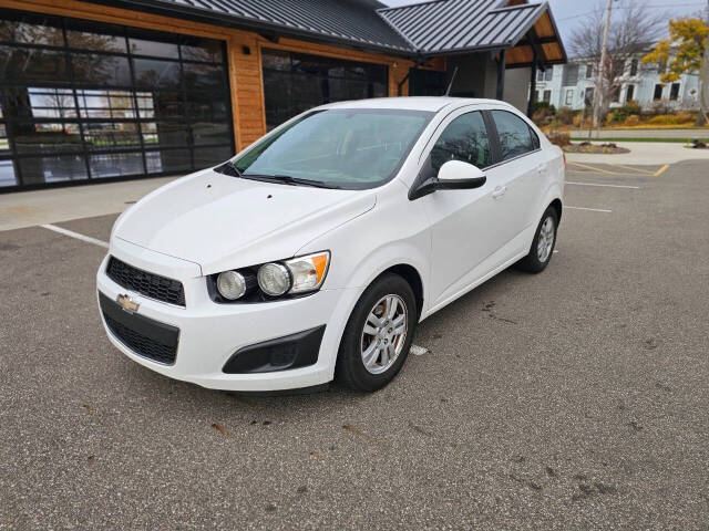 2014 Chevrolet Sonic for sale at WAGNER AUTO MART LLC in Ann Arbor, MI