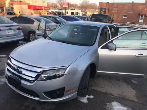 2012 Ford Fusion for sale at HIDALGOS AUTO SALES in Omaha NE