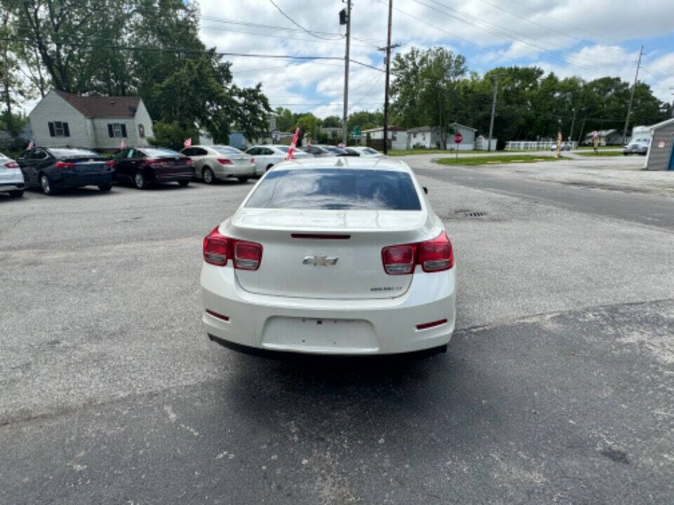 2013 Chevrolet Malibu for sale at Mitrione Motors in Springfield, IL