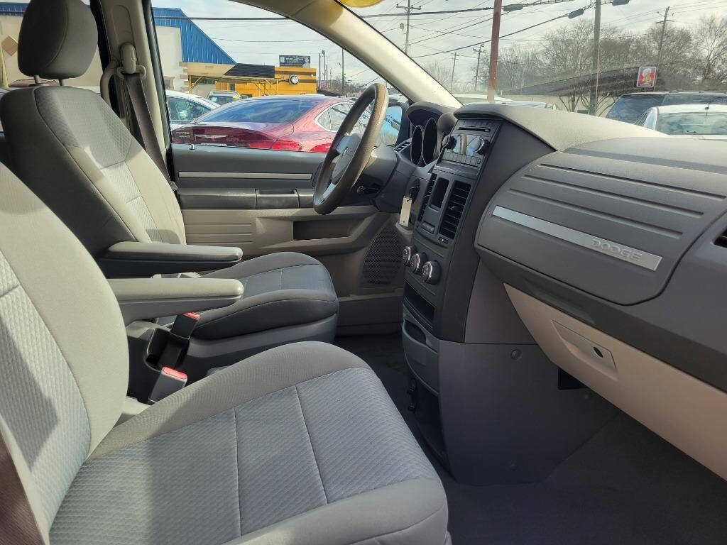 2010 Dodge Grand Caravan for sale at DAGO'S AUTO SALES LLC in Dalton, GA