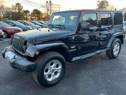 2015 Jeep Wrangler Unlimited for sale at Capital Motors in Raleigh NC