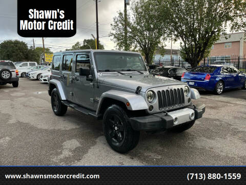 2015 Jeep Wrangler Unlimited for sale at Shawn's Motor Credit in Houston TX