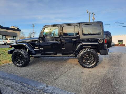 2012 Jeep Wrangler Unlimited for sale at G AND J MOTORS in Elkin NC