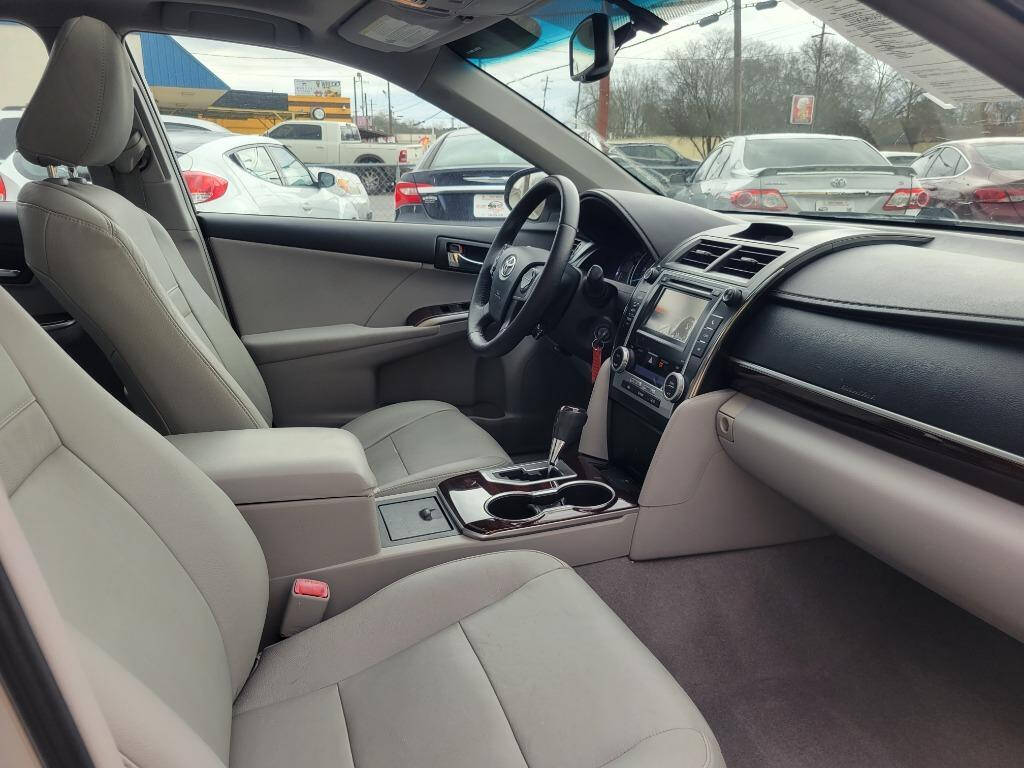 2012 Toyota Camry for sale at DAGO'S AUTO SALES LLC in Dalton, GA