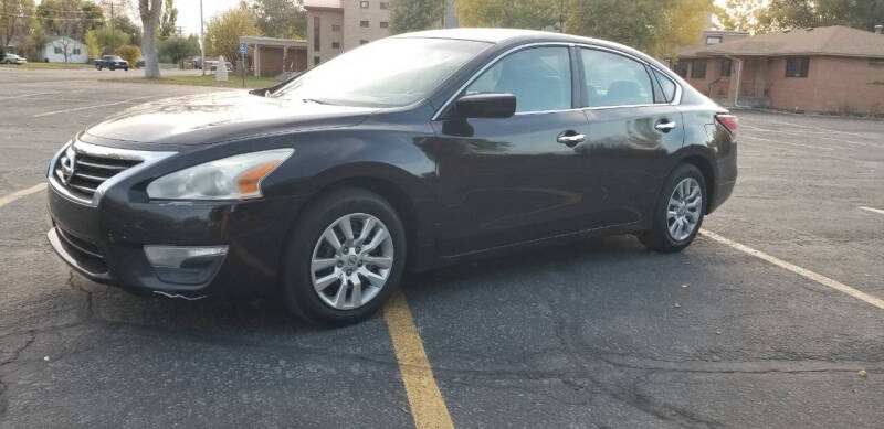 2015 Nissan Altima for sale at KHAN'S AUTO LLC in Worland WY