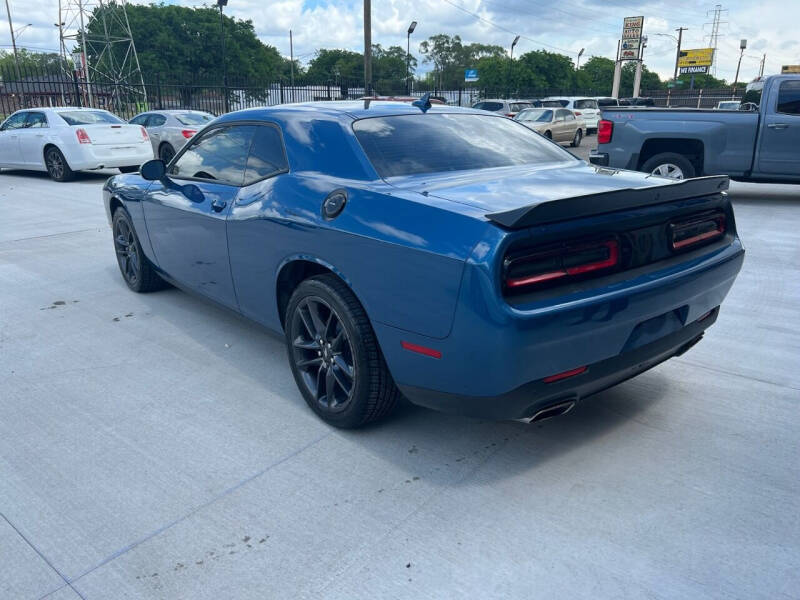 Used 2021 Dodge Challenger SXT with VIN 2C3CDZGG1MH543386 for sale in Detroit, MI