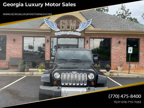 2012 Jeep Wrangler Unlimited for sale at Georgia Luxury Motor Sales in Cumming GA