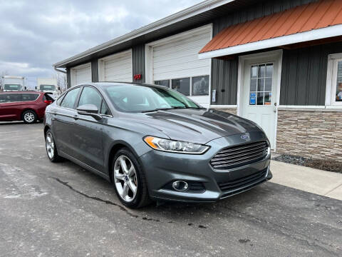 2013 Ford Fusion for sale at PARKWAY AUTO in Hudsonville MI