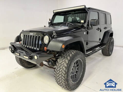 2011 Jeep Wrangler Unlimited for sale at Autos by Jeff in Peoria AZ