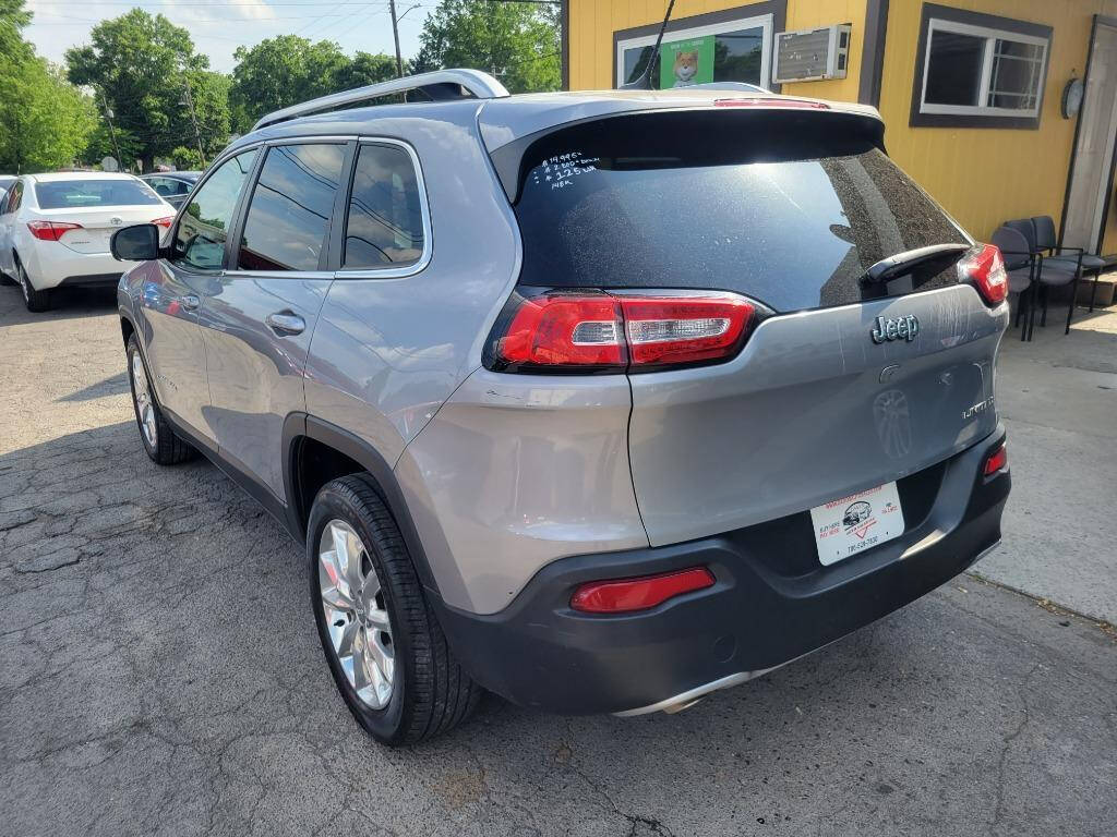 2014 Jeep Cherokee for sale at DAGO'S AUTO SALES LLC in Dalton, GA