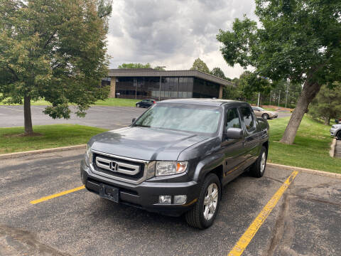 2011 Honda Ridgeline for sale at QUEST MOTORS in Englewood CO