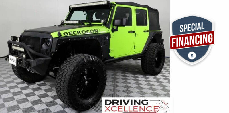 2013 Jeep Wrangler Unlimited for sale at Driving Xcellence in Jeffersonville IN