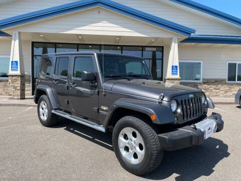 2014 Jeep Wrangler Unlimited for sale at The Car Buying Center in Saint Louis Park MN