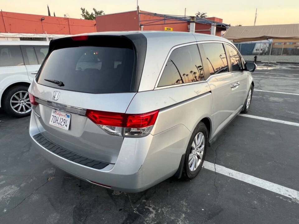 2014 Honda Odyssey for sale at Unique Auto Sales, Inc. in Bell, CA