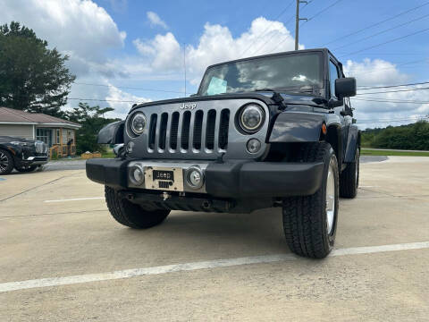 2014 Jeep Wrangler for sale at A&C Auto Sales in Moody AL