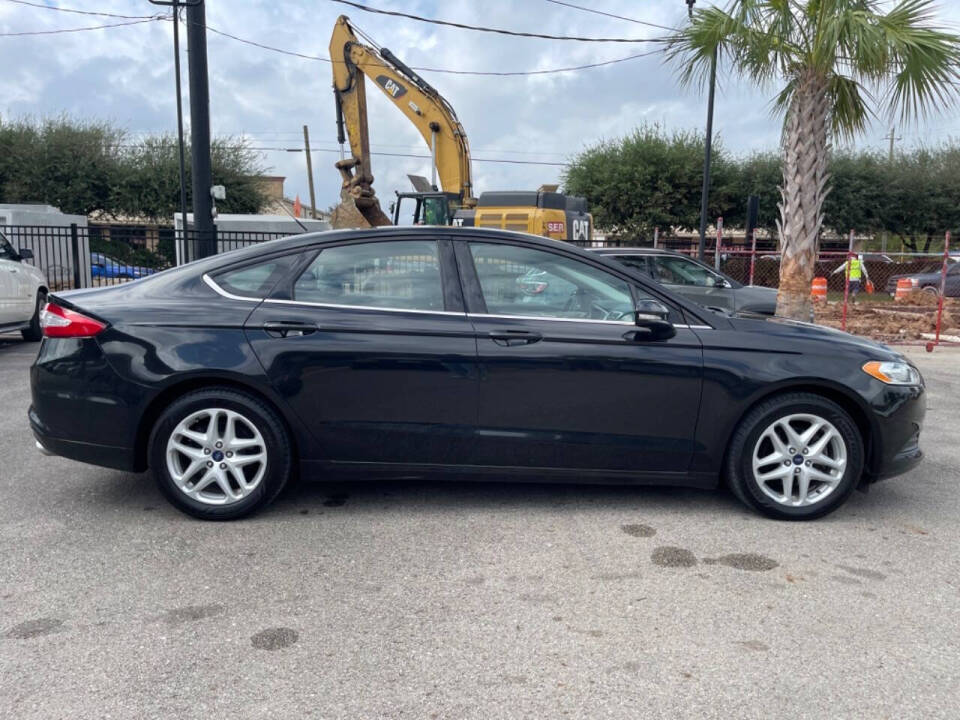 2014 Ford Fusion for sale at SMART CHOICE AUTO in Pasadena, TX