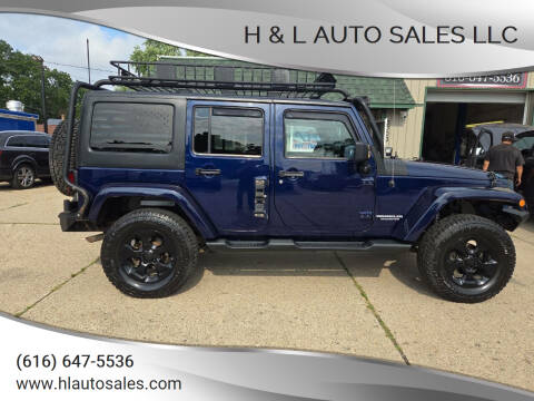 2013 Jeep Wrangler Unlimited for sale at H & L AUTO SALES LLC in Wyoming MI