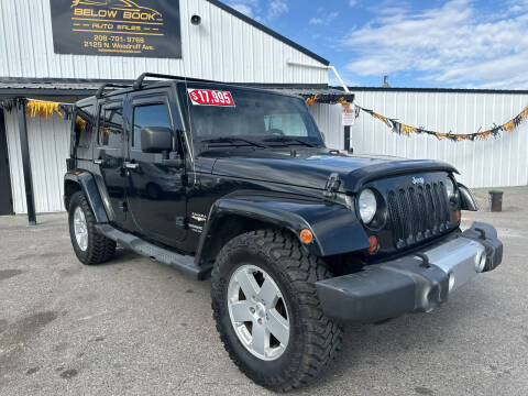 2012 Jeep Wrangler Unlimited for sale at BELOW BOOK AUTO SALES in Idaho Falls ID