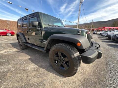 2011 Jeep Wrangler Unlimited for sale at Starter Cars in Altoona PA