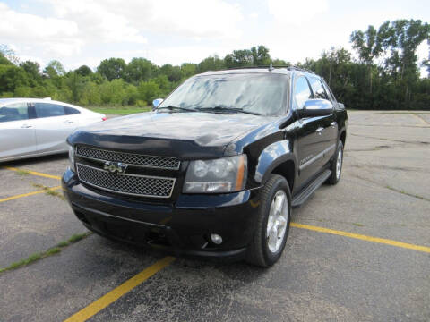 2009 Chevrolet Avalanche for sale at Caruzin Motors in Flint MI