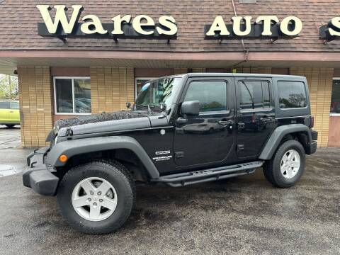 2013 Jeep Wrangler Unlimited for sale at Wares Auto Sales INC in Traverse City MI