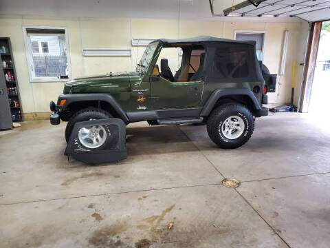 1997 Jeep Wrangler for sale at MADDEN MOTORS INC in Peru IN