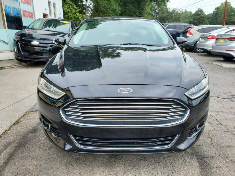 2016 Ford Fusion for sale at DAGO'S AUTO SALES LLC in Dalton, GA