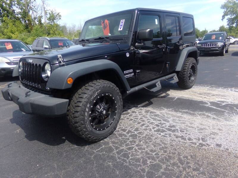 2014 Jeep Wrangler Unlimited for sale at Pool Auto Sales Inc in Spencerport NY
