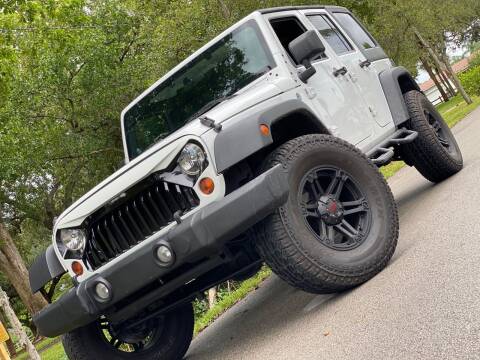 2011 Jeep Wrangler Unlimited for sale at HIGH PERFORMANCE MOTORS in Hollywood FL